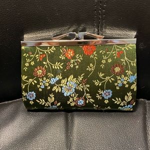 NWOT- Floral design clutch, with silver clasp.